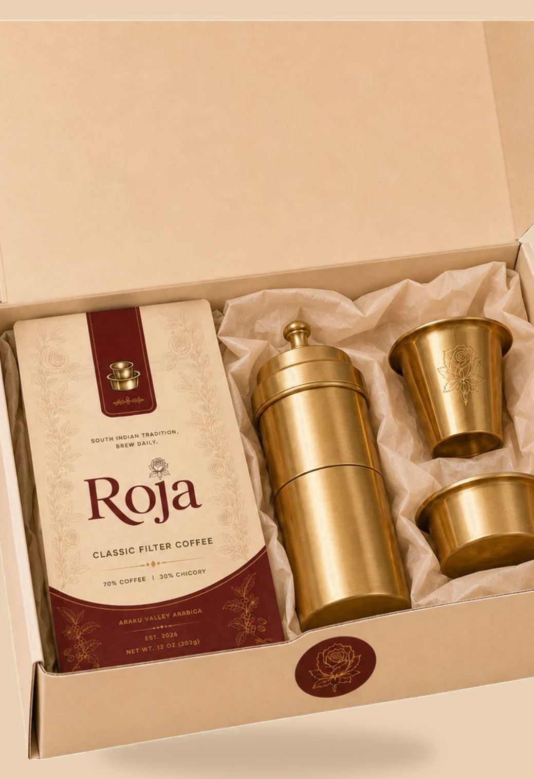Roja gift box, open, showing the coffee bag, filter, tumbler, and davara nestled in tissue paper